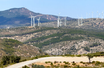 Wind turbine in mountains. Eolic park windpower. Wind farm or New Wind green energy. Wind turbines...
