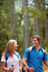 Happy couple, hiking and outdoor with backpack, walk and nature for travel, adventure and bonding. People, journey and countryside for discovery, fitness and exploring for recreation, gear and trek