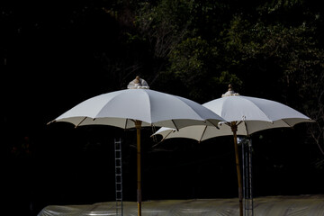 Cloth umbrellas are used to decorate restaurants for beauty.