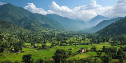 Sun shining on a valley full of rice fields and houses in the himalayas © alenagurenchuk