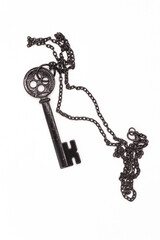 Black key necklace on isolated white background.