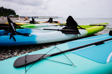 Kayaks and SUP boards on the sea. Extreme sport. Leisure. High quality photo
