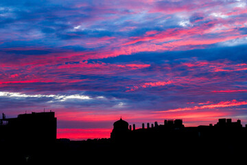 Stunning colorful sunset on a city landscape background © Linaa