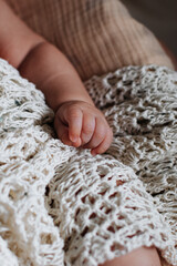 Tiny hand of a newborn baby, childcare and love concept