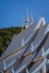 The temple's chapel has a beautiful white roof.
