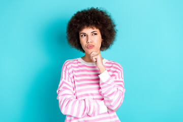 Photo of pretty doubtful lady dressed pink pullover arm chin looking empty space isolated teal color background