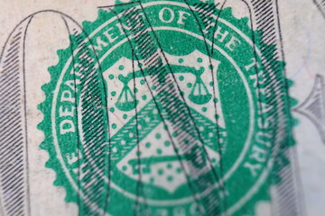 Fototapeta premium Stamp of the Department of The Treasury on US one dollar bill closeup macro