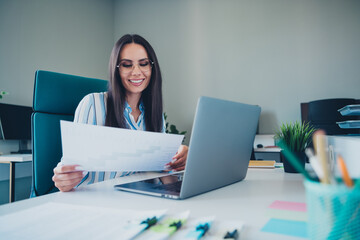 Photo of smart chief female working document graph wear striped formalwear comfortable modern office interior indoors workspace