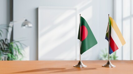 FLAGS OF BANGLADESH AND COMOROS ON TABLE