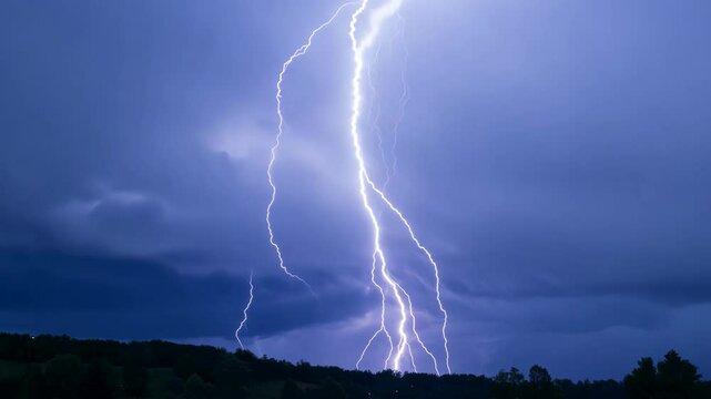 Captivating lightning strikes illuminate the dark sky over a serene landscape at dusk