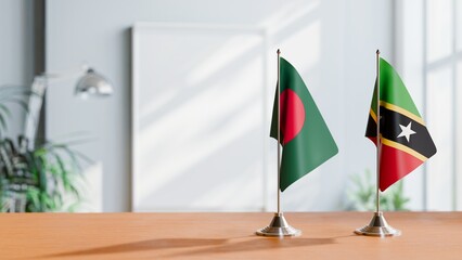 FLAGS OF BANGLADESH AND SAINT KITTS ON TABLE