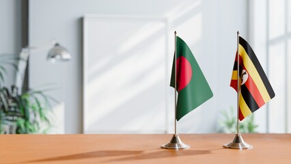 FLAGS OF BANGLADESH AND UGANDA ON TABLE