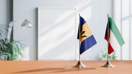 FLAGS OF BARBADOS AND KUWAIT ON TABLE