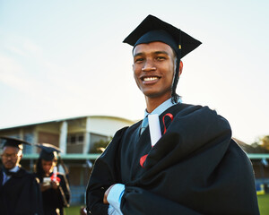Black man, student and arms crossed at outdoor graduation, celebration and dream achievement. Male person, learning pride and certified for university success, education victory and knowledge goals
