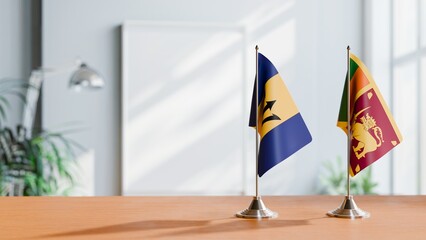 FLAGS OF BARBADOS AND SRI LANKA ON TABLE