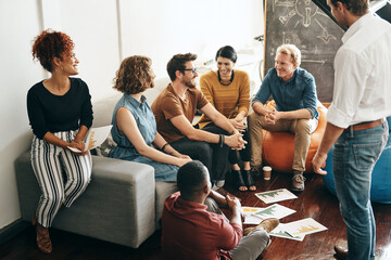 Fototapeta premium Small business, people and office with documents for creativity, collaboration and teamwork. Diversity, coworking and happy on strategy for project as graphic designer as partners in startup company