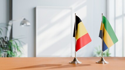 FLAGS OF BELGIUM AND GABON ON TABLE