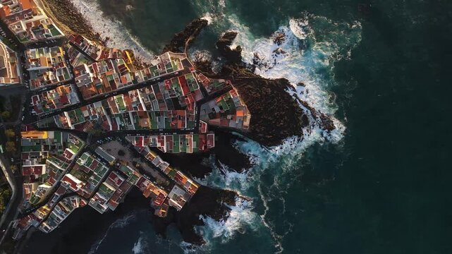 Aerial view of Charcones Punta Brava with beautiful coastline and historic architecture, Puerto de la Cruz, Spain.