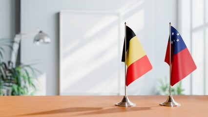 FLAGS OF BELGIUM AND SAMOA ON TABLE