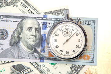 mechanical stopwatch on the background of dollars. Part time accuracy for business. business and finance time.