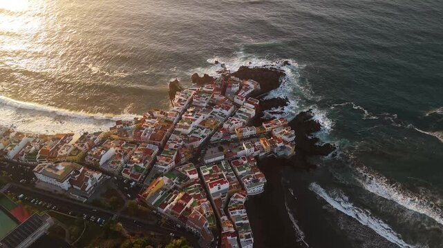 Aerial view of charcones punta brava with beautiful coastline and historic town, Puerto de la Cruz, Spain.