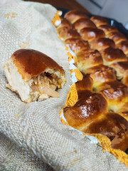 Close-up of baked cabbage pies on a homespun cloth on a wooden table. Concept of traditional...