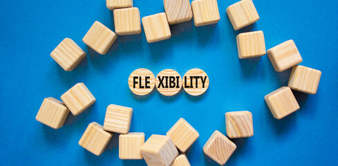 Flexibility symbol. Concept word Flexibility on beautiful wooden circles. Beautiful blue table blue...