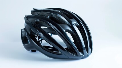 Black bicycle helmet lying on white background