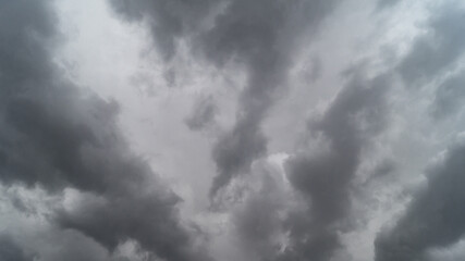 Obraz premium The sky is covered with gray clouds. Gray fluffy rain clouds close-up