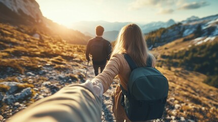 Couple hiking on a mountain trail during sunset, enjoying a scenic view and each other's company