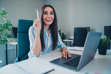 Photo of nice woman eureka brilliant idea working dressed striped formalwear comfortable light startup office room interior