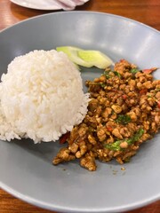 rice topped stir-fried pork and basil