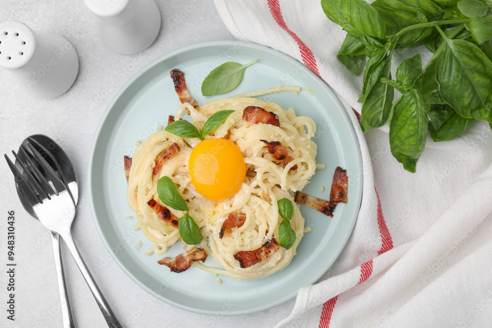 Sticker Delicious pasta Carbonara served on light gray table, flat lay