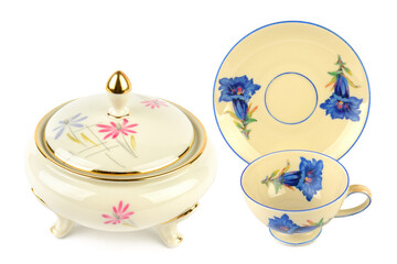 Vintage porcelain tableware: small coffee cup with saucer and elegant candy bowl isolated on white. Collage.