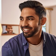 Obraz premium Person smiling at their reflection in a mirror.