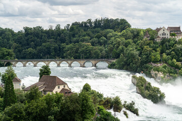 Rhine Falls (Rheinfall) in Switzerland, with castle Schloss Laufen, Neuhausen near the Canton Schaffhausen in Europe