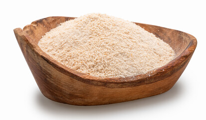 Manioc or cassava flour in wooden bowl on white background. File contains clipping path.