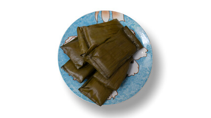 Indonesian Traditional Snack Nagasari on a Plate with Plantain Filling Isolated on White Background