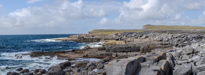 Inishmore, a view of the sea and cliffs with Dun Aonghasa in the background