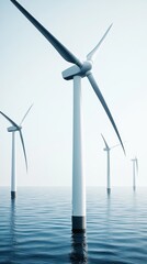 Turbines stand tall in the tranquil waters of the ocean, harnessing wind energy under a clear sky