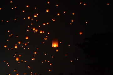 Lanterns floating in the night sky during Vesak Day ceremony in Borobudur Temple, Magelang.