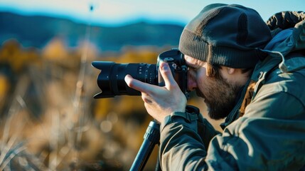 Obraz premium A photographer adjusting the camera focus while capturing a portrait