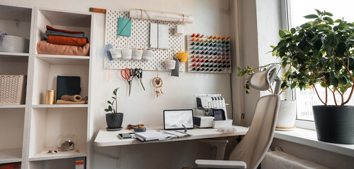 A Cozy Creative Workspace seamstress Featuring Organized Supplies and Abundant Natural Light That Inspires