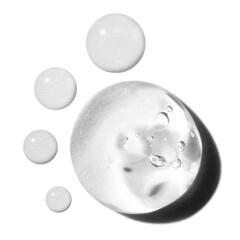 composition of smears of transparent cosmetic gel and drops on an empty background