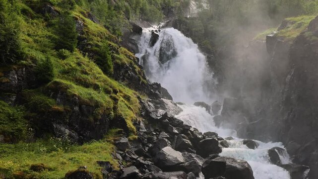 Latefossen Waterfall Cascade in Granvin, Odda, Norway, Scandinavia - Pedestal Down. Big Waterfall in Norway in SloW Motion 4K.