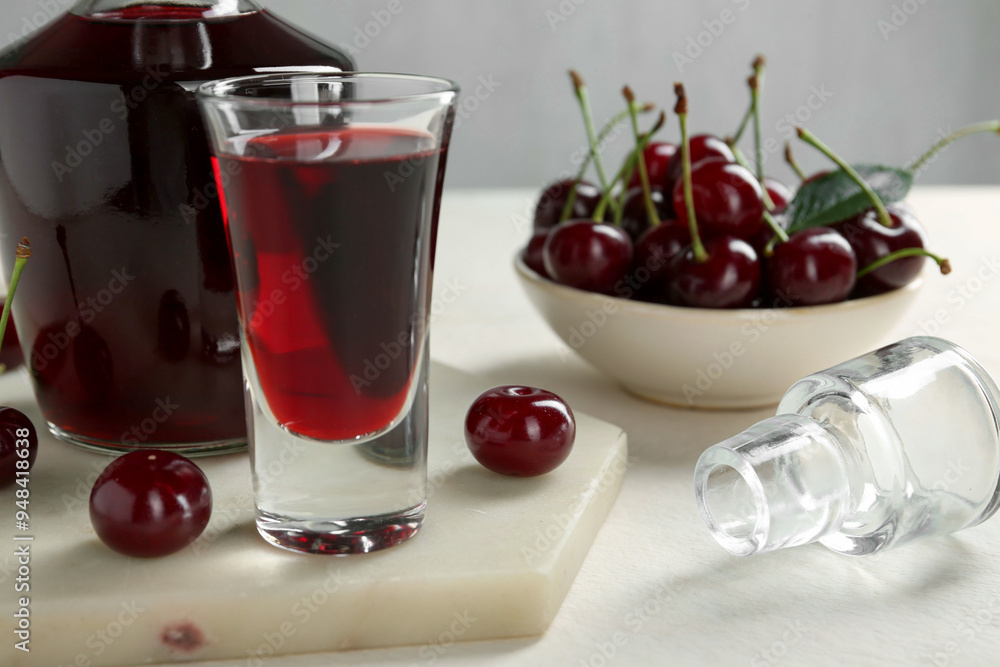 Canvas Prints Delicious cherry liqueur and berries on white table, closeup