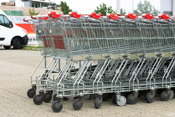 metal shopping carts in the supermarket parking lot