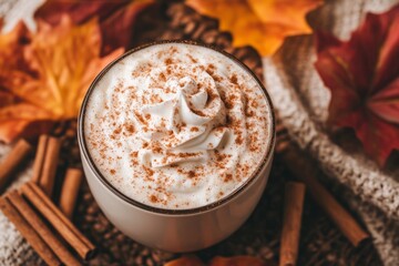 Close-up of a pumpkin spice latte with whipped cream and cinnamon, perfect for fall.