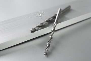 Bits and plank on light table, closeup