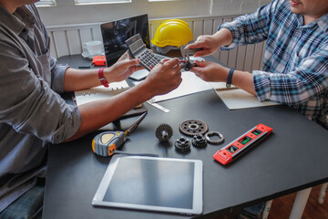 The factory mechanical engineering team is designing and developing gear sets to keep the machines running perfectly because gear sets are essential in the working system of large machines.